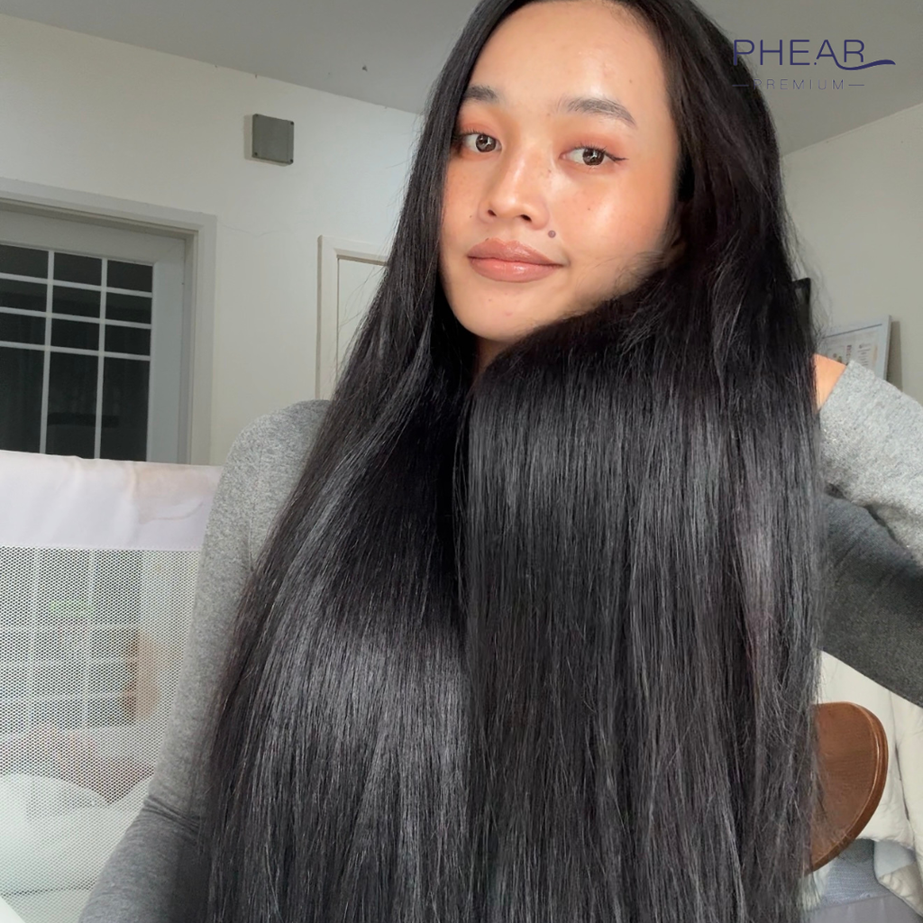 Beautiful woman with long, straight hair in a casual indoor setting