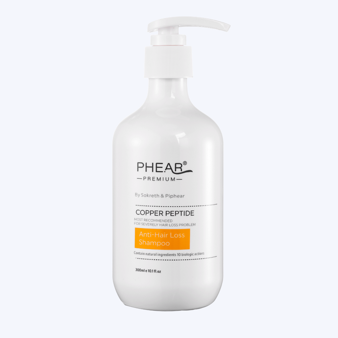 White shampoo bottle with pump labeled 'PHEAR Premium' on a white background