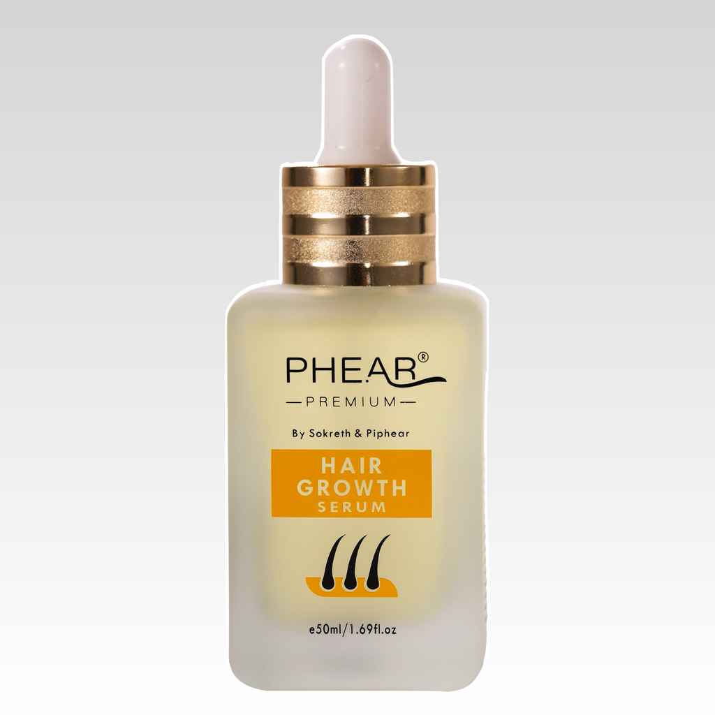 PHEAR hair growth serum bottle on a light blue background