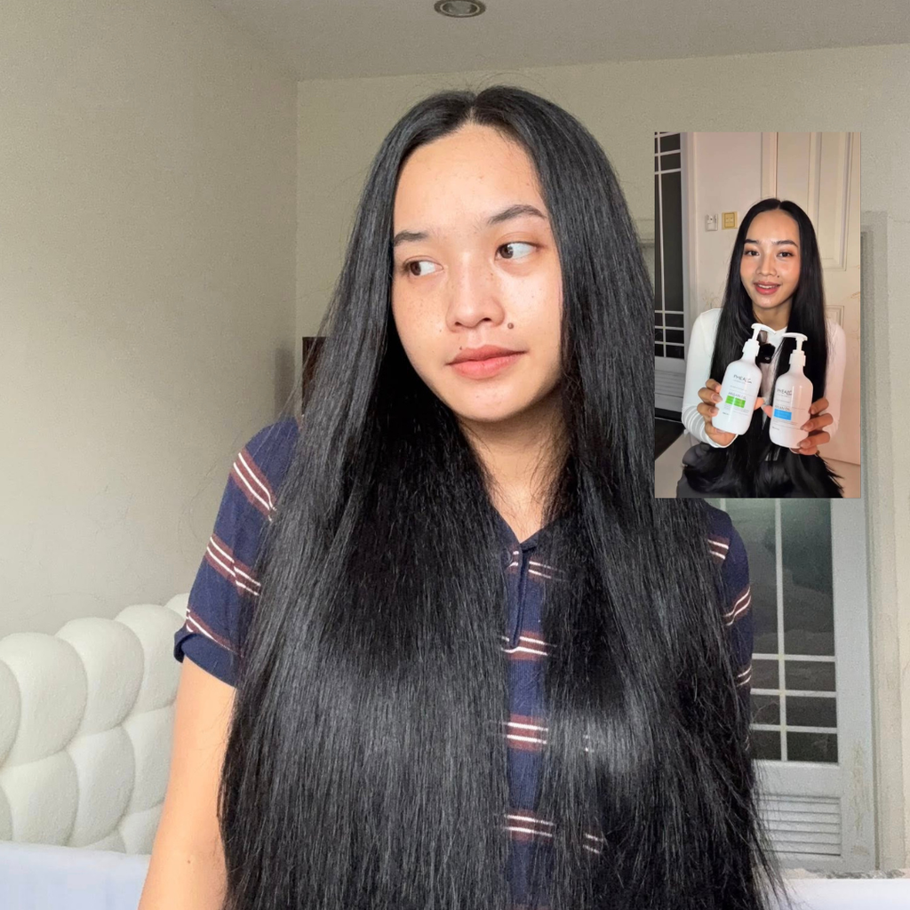 Woman with long black hair in a room with a couch and window.